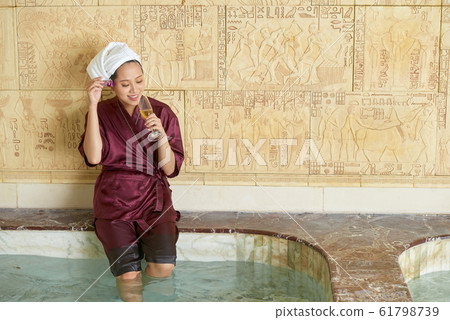 Woman Drinking Champagne In Spa Woman Drinking Champagne In Spa 61798739