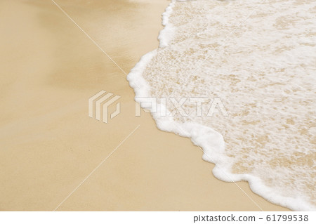 Tropical beach background with soft wave and sand 61799538
