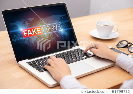 people reading fake news or HOAX on internet content via laptop 61799725