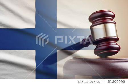 Lawyers wooden gavel over the flag of Finland 61800990