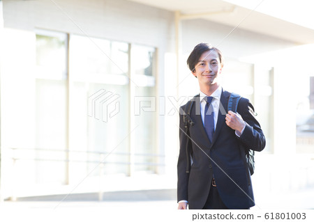 A young man in a suit A young man in a suit 61801003