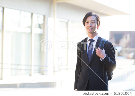 A young man in a suit A young man in a suit 61801004