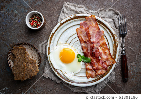 Fried eggs and bacon Fried eggs and bacon 61801180
