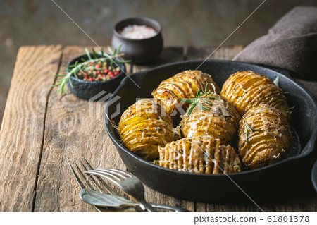 Baked hasselback potatoes Baked hasselback potatoes 61801378