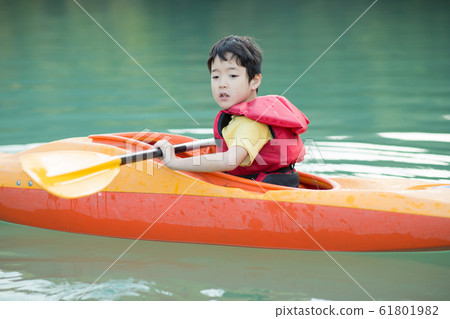 Children enjoying a canoe Children enjoying a canoe 61801982