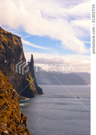 Trollkonufingur, also called The Witch's Finger on Faroe Islands Trollkonufingur, also called The Witch's Finger on Faroe Islands 61802554