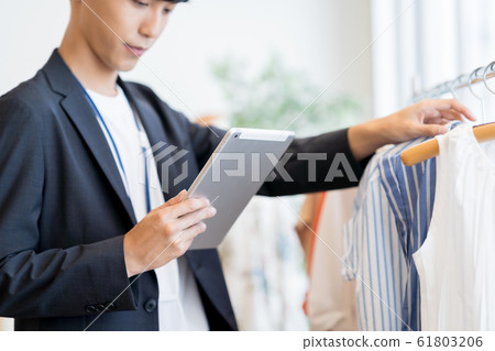 Young man, clerk, inventory, check Young man, clerk, inventory, check 61803206