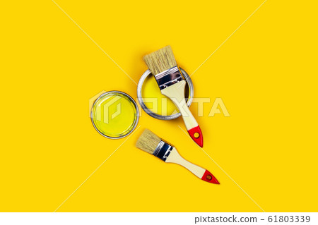 Colored background with paint jar and brushes. 61803339