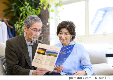 Senior couple planning a trip Senior couple planning a trip 61804109