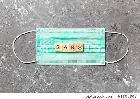 SARS word written on wood block lying on medical SARS word written on wood block lying on medical 61806808