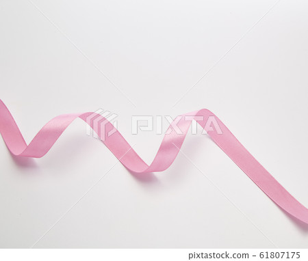 Pink curly ribbon isolated on white Pink curly ribbon isolated on white 61807175
