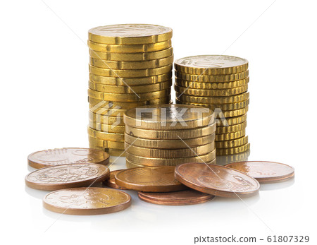Stacked coins isolated Stacked coins isolated 61807329