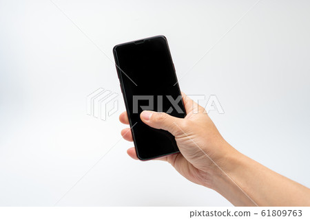 Hand holding smartphone 61809763