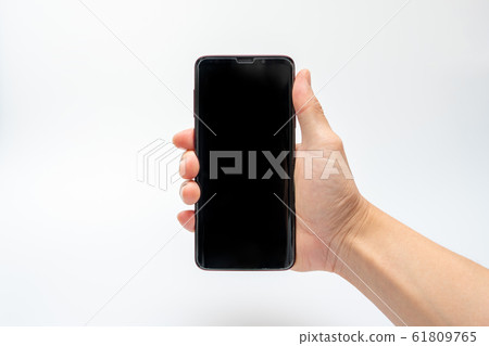 Hand holding smartphone 61809765