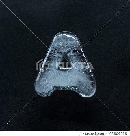 Alphabet's letters made out of ice isolated on dark studio background Alphabet's letters made out of ice isolated on dark studio background 61809918