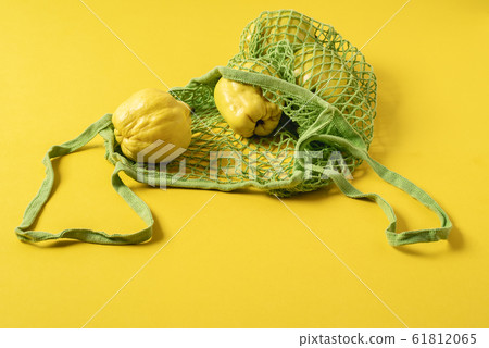 Quince fruits in reusable shopping bag. No plastic Quince fruits in reusable shopping bag. No plastic 61812065