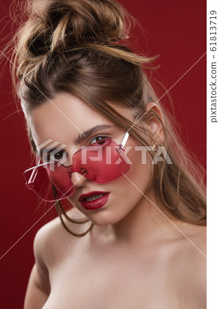 Gorgeous fashionable girl in pink sunglasses on Gorgeous fashionable girl in pink sunglasses on 61813719