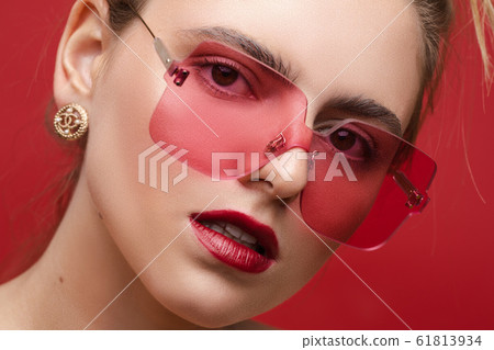 Gorgeous fashionable girl in pink sunglasses on Gorgeous fashionable girl in pink sunglasses on 61813934