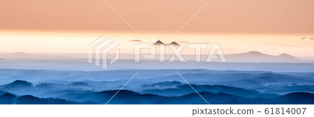 Bezdez twin mountains rising from the mist. Weather temperature inversion, Czech Republic 61814007