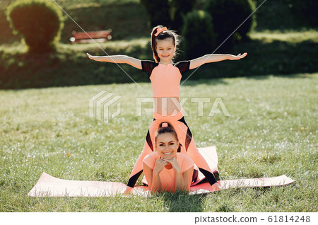 Sports family in a summer park Sports family in a summer park 61814248
