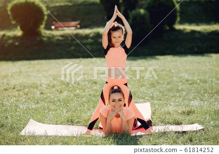 Sports family in a summer park Sports family in a summer park 61814252