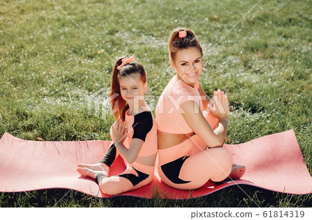 Sports family in a summer park Sports family in a summer park 61814319