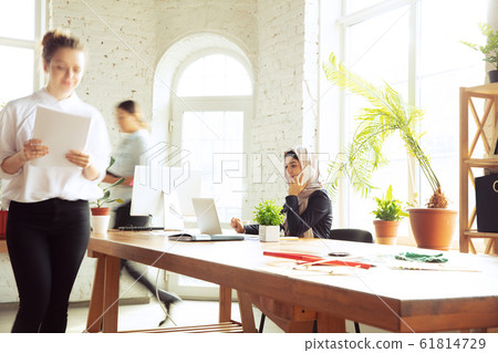 Portrait of a beautiful arabian businesswoman wearing hijab while working Portrait of a beautiful arabian businesswoman wearing hijab while working 61814729