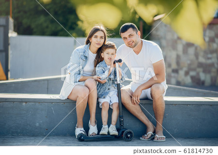 Cute family playing in a summer park Cute family playing in a summer park 61814730