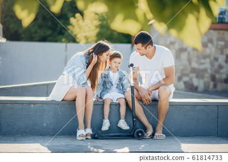 Cute family playing in a summer park 61814733