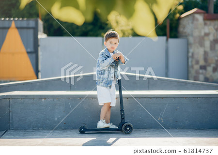 Cute little children playing in a summer park 61814737