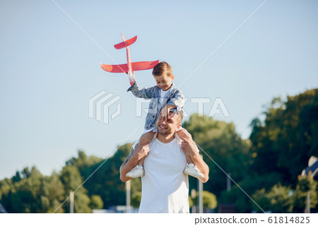 Cute family playing in a summer park 61814825