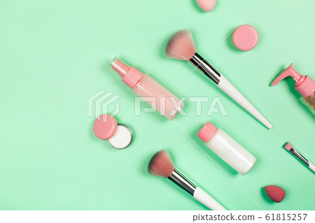 Care cosmetics on green background 61815257