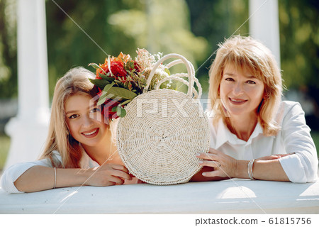 Mother with young daughter in a summer park 61815756