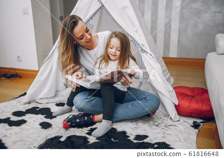 Mother with little daughter at home 61816648