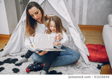 Mother with little daughter at home 61816649