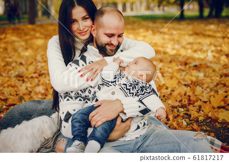 Family with son in a autumn park Family with son in a autumn park 61817217
