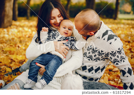 Family with son in a autumn park 61817294