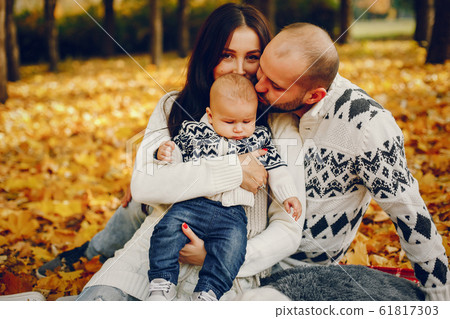 Family with son in a autumn park 61817303
