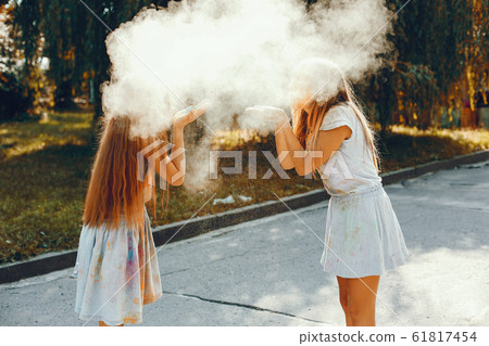 Two cute girls have fun in a summer park 61817454