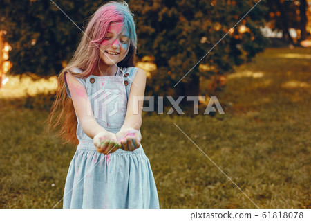 Cute girl have fun in a summer park Cute girl have fun in a summer park 61818078