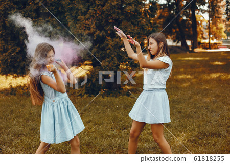 Two cute girls have fun in a summer park 61818255
