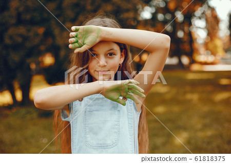 Cute girl have fun in a summer park 61818375