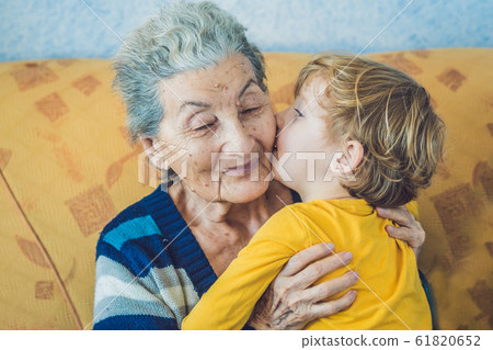 portrait of a Happy Boy Kissing Happy Grandmother portrait of a Happy Boy Kissing Happy Grandmother 61820652