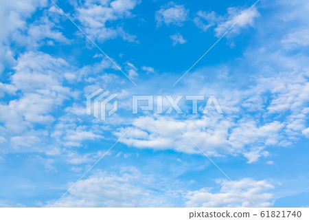 Light cumulus clouds in the blue sky on a sunny day, full frame image, background Light cumulus clouds in the blue sky on a sunny day, full frame image, background 61821740