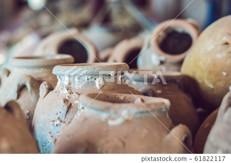 Ancient Vietnamese traditional pots overgrown with seashells Ancient Vietnamese traditional pots overgrown with seashells 61822117