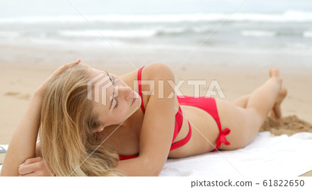 A relaxing day on a sandy beach at the ocean A relaxing day on a sandy beach at the ocean 61822650