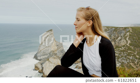 Sitting at the coast of Cabo da Roca in Portugal Sitting at the coast of Cabo da Roca in Portugal 61822651