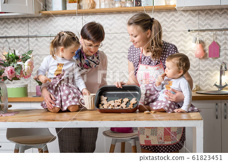 Sisters 1 and 3 years old girls with their mother Sisters 1 and 3 years old girls with their mother 61823451