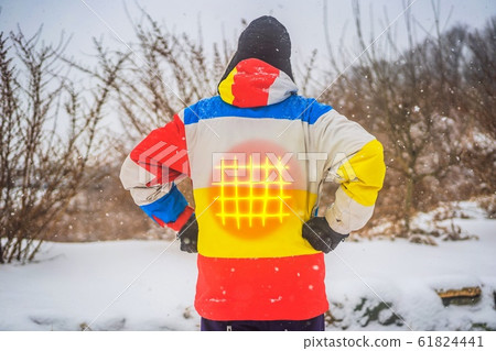 A man in a heated winter jacket. Under the jacket heating elements 61824441