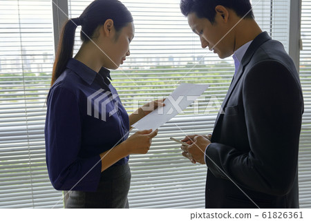 Vietnamese business people working in office Vietnamese business people working in office 61826361